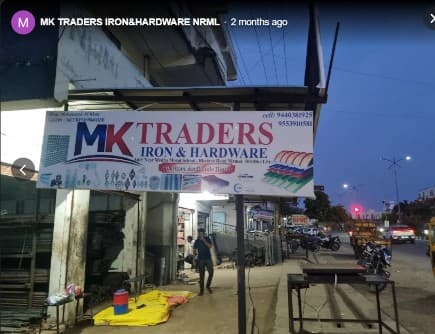 MK TRADERS IRON & HARDWARE shop signboard in Nirmal