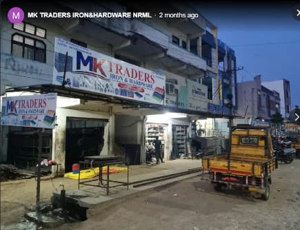 MK TRADERS wide building and shopfront view in Nirmal